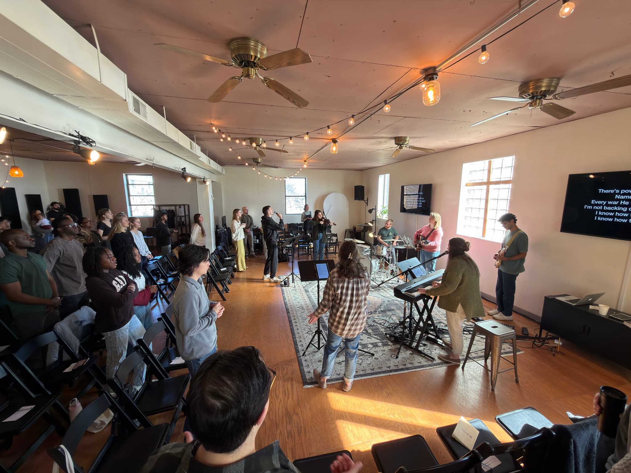 New Culture Church gathered on a sunlit Sunday morning, the worship team leading from the front of their downtown Madison space